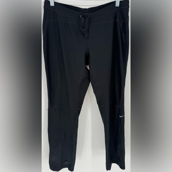 Nike Women's Dri-FIT Unlimited Zippered Cuff Versatile Pants - Picture 1 of 16